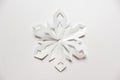 Large white snowflake on white backgound Royalty Free Stock Photo