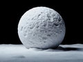A large white sphere sitting on top of a snow covered ground Royalty Free Stock Photo