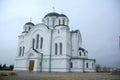 A large white stone church with a golden dome and a bell in eastern Europe is a Christian orthodox for the prayers of God Royalty Free Stock Photo