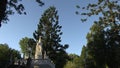 Large white tomb belittled by surrounding trees