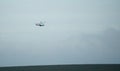 Large white training helicopter flying low on a military exercise Royalty Free Stock Photo