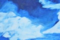 Large white watercolor smears on a blue background on canvas.