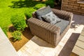 Large Wicker Arm Chair On Back Yard Patio Royalty Free Stock Photo