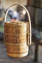 Large wicker jar made of wood as a household item in the market in the village. Cambodia