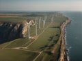 large wind farms on the green seashore generating energy for humanity