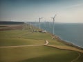 large wind farms on the green seashore generating energy for humanity