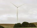 A large wind turbine moving to create kinetic energy for renewable energy supply Royalty Free Stock Photo