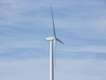 A large wind turbine moving to create kinetic energy for renewable energy supply Royalty Free Stock Photo