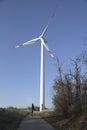 Large wind turbines with man. Production of clean and renewable energy. Trentino, Italy