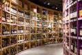 Large wine racks. Many different alcoholic beverages. Luxury enoteca. The photo is blurry