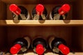 Large wine racks. Many different alcoholic beverages. Luxury enoteca. The photo is blurry Royalty Free Stock Photo