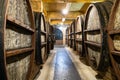 large wood brandy barrels in NOY factory basement