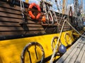 Large wooden blocks are attached to different ropes of a large sailing vessel Royalty Free Stock Photo