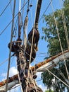 Large wooden blocks are attached to different ropes of a large sailing vessel Royalty Free Stock Photo