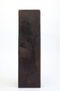 Large wooden brown block. Design column made of wood. On white background