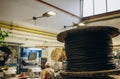 Large wooden cable pulleys with electric cables. Cable reels, cable drums lying on the construction site. In the Royalty Free Stock Photo