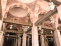 Large wooden ceiling beams, planks, ceilings under the ceiling with arches and lamps, lanterns in the Arab Islamic Mosque, a templ