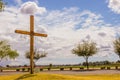 Large Wooden Cross On Grassy Knoll Next To Road Royalty Free Stock Photo