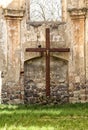 Large wooden crucifix on the wall of broken church Royalty Free Stock Photo