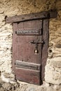 A large wooden door closed an old fortress in the stone wall of the castle in Germany on the Rhine River Royalty Free Stock Photo