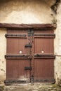 A large wooden door closed an old fortress in the stone wall of the castle in Germany on the Rhine River Royalty Free Stock Photo