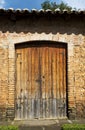 Large wooden door of old ranch house Royalty Free Stock Photo