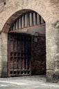 Large wooden door open in rock castle wall Royalty Free Stock Photo