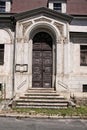 Large wooden door stone portal with ornaments