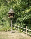 Large wooden dove cote in the afternoon sun