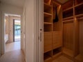 Large wooden dressing room on the right with lots of drawers and storage