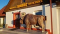 Large wooden figurine of a bison at the entrance to the Sumbers cafe which is located by the road in Latvia on May 22, 2020