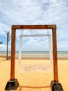 Large wooden picture frame on a sandy beach background, background, landscape, sea and beautiful sky.  Holiday Concept Royalty Free Stock Photo