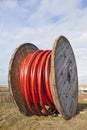 Large wooden spool with heavy underground cable