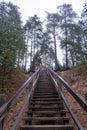 A large wooden staircase leading to the lalarge wooden stairs leading to the lake