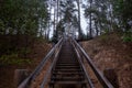 A large wooden staircase leading to the lalarge wooden stairs leading to the lake