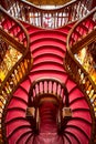 Large wooden staircase with red steps inside library bookstore Livraria Lello in historic center of Porto, famous for Harry Potter Royalty Free Stock Photo