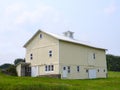 Historic upstate NY board & batten wood barn with gable roof ventilation cupola