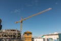 Large Yellow Construction Crane Against Blue Sky