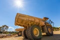 Large yellow dumper trucks.