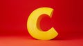Large yellow letter c on a bright red background, bold design concept Royalty Free Stock Photo