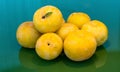 Large yellow plums on on green glass table, selective focus Royalty Free Stock Photo