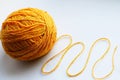 Large yellow tangle of yarn on a bright background