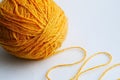 Large yellow tangle of yarn on a bright background