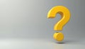 A large yellow three-dimensional question mark floats on a neutral gray studio background. The symbol implies uncertainty doubt Royalty Free Stock Photo