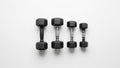 The largest dumbbell is on the left, while the smallest is on the right Royalty Free Stock Photo
