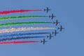 Largest Military Show at Marjan Island with coordinated military aircrafts showing the UAE flag colors on the bright blue sky