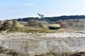 Largest Walking Dragline Excavator in the chalk quarry. Big Muskie in open pit mining. Mining Dragline. Heavy mining industry and Royalty Free Stock Photo