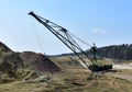 Largest Walking Dragline Excavator in the chalk quarry. Big Muskie in open pit mining. Mining Dragline. Heavy mining industry and Royalty Free Stock Photo