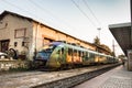 A suburban train parked at platform of the Larissa Train Station