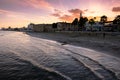 People by the waterfront in Larnaca. View towards Larnaca castle and Kebir-Buyuk mosque.